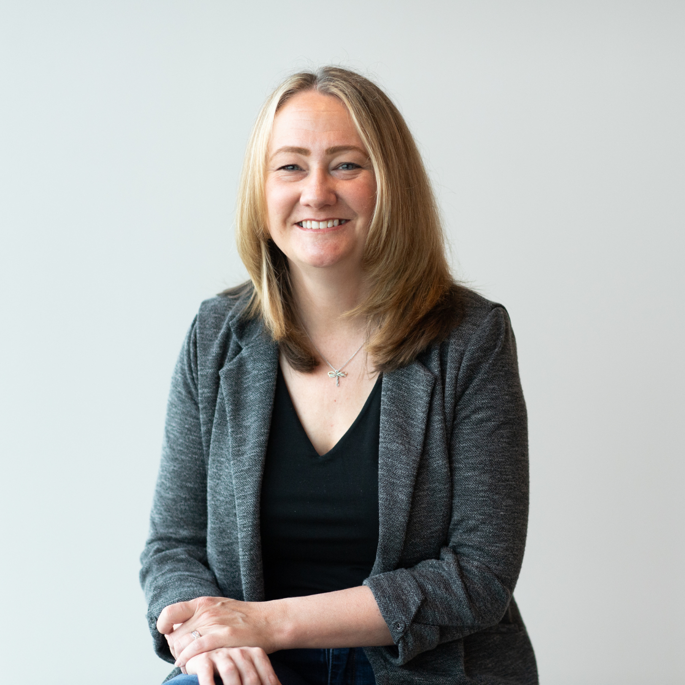 Kristen Borden Kristen Borden, VP Human Resources, smiling at BerkleyNet, a fast and easy workers compensation insurance provider.